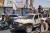 아프간 남부 칸다하르 주를 점령한 탈레반 반군 전사들이 13일(현지시간) 정부군 차량을 몰고 거리를 달리고 있다. [AFP=연합뉴스]