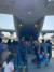 한국정부 활동을 지원해 온 아프간 현지인 직원과 가족 391명이 25일(현지시간) 카불 공항에서 중간기착지 파키스탄 이슬라마바드 공항으로 이동하기 위해 공군 수송기에 탑승하고 있다. [사진 외교부]