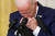 조 바이든 미국 대통령이 26일(현지시간) 백악관 기자회견 중 고개를 숙인 채 기자의 질문을 듣고 있다. [로이터=연합뉴스]