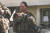 지난 20일(현지시간) 니콜 지(23) 병장이 아프가니스탄 미 철군 현장에서 아프간 아기를 돌보고 있다. [AP=연합뉴스]