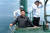 2014년 6월 김정은 북한 국무위원장이 잠수함 망루에 올라 해상훈련을 지휘하고 있다 . 조선중앙통신