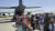아프가니스탄 현지 특별 기여자와 가족들이 지난달 25일(현지시간) 아프가니스탄 카불공항에서 공군 C-130J 수퍼허큘리스 수송기에 탑승하기 위해 대기하고 있다. 공군