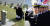 노태우 전 대통령의 아들 재헌씨가 지난 4월 22일 국립 5·18민주묘지에서 희쟁자들의 묘역을 참배하고 있는 모습(왼쪽). 오른쪽은 지난 2014년 11월 26일 해군사관학교 교정에서 열린 제117기 해군 해병대 사관후보생 임관식에서 노 전 대통령의 손녀 최민정씨가 거수경례를 하고 있는 모습. [연합뉴스·뉴스1]