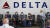 지난 7월 미국 솔트레이크시티 국제공항에서 델타항공 로고가 적혀진 좌석에 관광객들이 앉아 여객기 탑승을 기다리고 있다. [AP=연합뉴스]