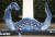 지난달 30일 영국 런던 그로스브너 광장에서 한 어린이가 청바지를 재활용한 조각품인 네스호의 괴물 옆을 지나고 있다 연합뉴스