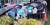 지난 8일 오전 서울 송파구 보건소 코로나19 선별검사소에서 시민들이 검사를 받기 위해 우산을 쓴 채 차례를 기다리고 있다.   연합뉴스