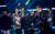 방탄소년단이 '2021 아메리칸 뮤직 어워드'에서'페이보릿 팝 듀오 오어 그룹'을 수상한 뒤 환호하고 있다. [연합뉴스] 