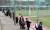 인천 미추홀구 교회의 외국인 신도들이 10일 오후 인천시 미추홀구청 앞 운동장에서 워킹스루 방식으로 코로나19 검사를 받기 위해 길게 줄지어 대기하고 있다. 뉴스1
