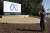 지난 10월 28일 캘리포니아 페이스북 본사에 세워진 메타(구 페이스북)의 로고 간판 앞에서 사진을 찍는 직원의 모습. [AP=연합뉴스]