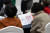 Senior citizens read pamphlets at a job fair held Yangcheon District, western Seoul, on Nov. 9. [NEWS1] 