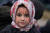 지난달 벨라루스의 난민촌 천막에서 얼굴에 붉은 글씨를 쓴 어린 소녀. 두 뺨에는 "나는 아기에요"와 눈물 표시, 이마에는 "죽음"이라고 쓰여있다. 로이터=연합뉴스