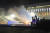알마티 경찰이 시위대를 향해 최루탄을 발사하고 있다. AP=연합뉴스