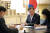 아랍에미리트(UAE)를 방문한 문재인 대통령이 17일(현지시간) 두바이 한 호텔에 마련된 숙소 회의실에서 무함마드 빈 자이드 알 나하얀 아부다비 왕세제와 통화하고 있다. 연합뉴스