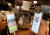 지난 13일 서울 시내의 한 카페에서 방문 고객이 전자출입명부 QR코드를 태그하는 모습. 연합뉴스