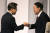 이재명 민주당 대선 후보(왼쪽)와 윤석열 국민의힘 대선 후보가 25일 오후 서울 마포구 상암동 SBS스튜디오에서 열린 TV 토론회에 참석해 인사 나누고 있다. 뉴스1 