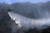 27일 오전 대구 달성군 가창면 용계리 주암산 산불 현장에 투입된 산불진화 헬기가 번갈아 물을 뿌리며 진화에 안간힘을 쏟고 있다. 뉴스1