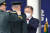문재인 대통령이 28일 경북 영천시 육군3사관학교에서 열린 제57기 졸업 및 임관식에서 우등상 수상자에게 우등메달을 목에 걸어주고 있다. 연합뉴스