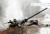  러시아군 탱크가 우크라이나군 공격에 파괴돼 연기를 내뿡고 있다. AFP=연합뉴스