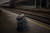 3일(현지시간) 키이우 역에서 한 여성과 그의 아들이 바닥이 주저앉은 체 떠나는 열차를 바라보고 있다. AP=연합뉴스