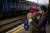 3일(현지시간) 우크라이나 키이우 역에서 한 우크라이나 여성이 눈물을 글썽이며 연인에게 작별 인사를 하고 있다. AP=연합뉴스