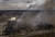 6일 이르핀에서 공장과 상가가 러시아군 포격으로 불타오르고 있다. [AP=연합뉴스]