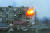 지난 11일 마리우폴의 한 아파트가 러시아군 탱크 공격을 받아 화염에 휩싸여 있다. [AP=연합뉴스]