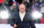 18일(현지시간) 러시아 모스크바 루즈니키 경기장에서 열린 '크림반도 병합 8주년 기념콘서트'에서 블라디미르 푸틴 대통령이 연설을 하기위해 무대 중앙으로 걸어나오고 있다. 로이터=연합뉴스