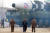 김정은 국무위원장(가운데)이 24일 평양 순안공항 일대에서 진행한 대륙간탄도미사일 발사현장을 둘러보고 있다. [뉴스1]