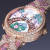 정오와 자정에 연인들이 만나도록 설계된 반클리프 아펠의 '사랑의 다리' 시계. 계절에 따라 네 가지 버전이 있다. 사진은 '봄'의 시계. [사진 반클리프 아펠]