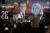 10일 프랑스 파리 선거본부 화면 모습. 마크롱 대통령(왼쪽)과 르펜 후보. AP=연합뉴스