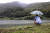문재인 대통령이 2018년 9월 29일 오전 경남 양산시 사저 뒷산에서 산책을 하던 중 저수지를 바라보며 생각에 잠겨 있다.
