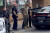 14일(현지시간) 무차별 총격 사건이 벌어진 미국 뉴욕주 버펄로의 한 슈퍼마켓 주차장에서 경찰이 용의자를 연행하고 있다. 로이터=연합뉴스