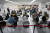 지난 3월 1일 일본 나리타 공항에서 입국자들이 코로나19 확산 방지를 위한 검역 절차를 밟고 있다. [AP=연합뉴스]