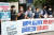 지난해 6월 민주노총 공공운수노조 조합원들이 서울 경제사회노동위원회(경사노위) 앞에서 기자회견을 열고 공공기관의 일방적 임금체계 개편 중단과 임금피크제 지침 폐기를 촉구하고 있다. [뉴스1]