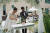 28일 광주 무등산 국립공원에서 열린 '숲속결혼식'에서 참가자 박영화(69)·강선경(54)씨 부부가 화촉 점화 대신 화분에 물을 주는 '플랜트 샤워'를 하고 있다. 장윤서 기자