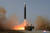 북한이 지난달 24일 김정은 국무위원장의 지도 아래 신형 대륙간탄도미사일(ICBM) '화성-17형' 시험발사를 단행하는 모습. 연합뉴스