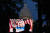 9일(현지시간) 미국 워싱턴 의사당 앞에 마련된 대형 스크린을 통해 시민들이 1.6 의회폭동 청문회 장면을 지켜보고 있다. [AP=연합뉴스]