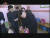 조선중앙TV가 2017년 4월 방영한 기록영화에서 학생들의 가방 놓는 위치를 수행 간부들에게 지도하는 김정은의 모습. 조선중앙TV 캡처