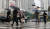 전국적인 장마 시작이 예보된 23일 오전 시민들이 서울 중구 을지로입구역 인근에서 우산을 쓰고 횡단보도를 건너고 있다. [연합뉴스]
