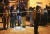 26일(현지시간) 10대 20여명이 집단 의문사한 남아프리카공화국 이스트런던의 한 술집 앞에서 유가족들이 경찰의 발표를 기다리고 있다. AFP=연합뉴스