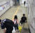 30일 오전 호우특보가 발령된 가운데, 수원시 권선구 1호선 전철 세류역 지하통로가 침수돼 출근길 시민들이 신발을 벗은 채로 걸어가고 있다. [트위터 캡처]