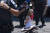  한 낙태 권리 운동가가 4일 워싱턴DC 연방대법원 앞에서 시위를 벌이다 폴리스라인을 넘었다는 이유로 경찰에 체포되고 있다. AP=연합뉴스 