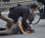 8일 일본 나라현에서 아베 전 총리에게 총을 쏜 용의자가 경찰에 체포되고 있다. [AFP=연합뉴스]