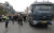 지난 6월 13일 울산시 고려아연 정문 앞에서 경찰이 화물차 진입을 막는 화물연대 조합원들을 통제해 화물차를 들여보내고 있다. [뉴스1]