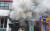 지난 11일 광주 북구 용봉동 한 전동퀵보드 업체에서 화재가 발생해 소방대원이 진화 작업을 하고 있다. [사진 광주 북부소방서]