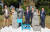 제주도와 제주올레, 스페인 관계자들이 12일 스페인 산티아고 순례길의 몬테도고소에서 제주 상징물인 돌하르방과 제주올레길 상징물인 간세를 설치한 후 기념 촬영을 하고 있다. 사진 제주도