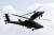 지난 25일 경기도 이천시 육군항공사령부에서 H-64E 아파치 가디언 공격헬기 2대가 이륙 후 회피기동을 하고 있다. 사진공동취재단