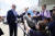조 바이든 미국 대통령이 8일(현지시간) 켄터키주 공항에서 기자들과 약식 회견을 하고 있다. AP =연합뉴스
