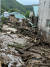 9일 오전 경기 광주시 남한산성면의 한 마을에 산사태가 발생해 토사와 부러진 나무들이 도로에 뒤덮여 있다. 연합뉴스