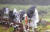 제11호 태풍 ‘힌남노’ 간접영향으로 비바람이 부는 2일 오후 제주 서귀포시 대정읍 송악산에 우산을 쓴 관광객들이 걸어가고 있다. 뉴시스